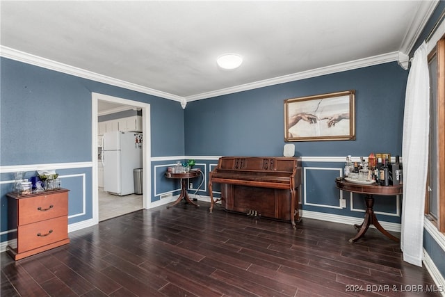 miscellaneous room featuring ornamental molding and dark wood-type flooring