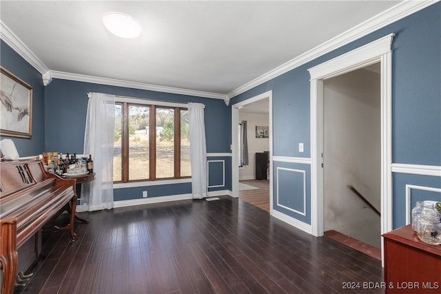 interior space with dark wood-type flooring and crown molding