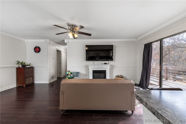 living room featuring crown molding, dark hardwood / wood-style floors, and ceiling fan