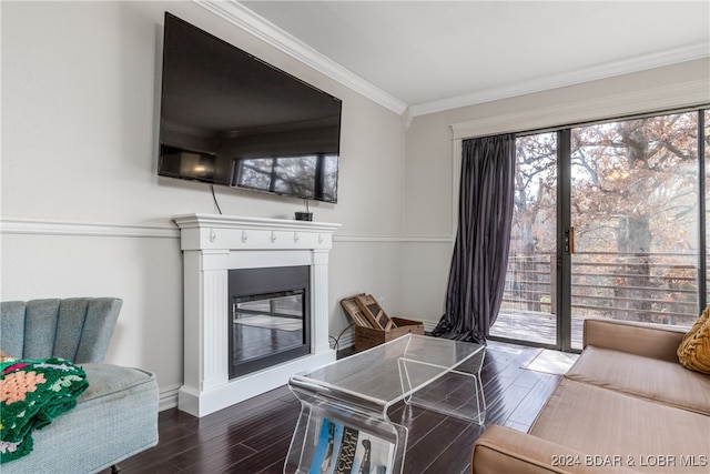 living room with crown molding and dark hardwood / wood-style floors