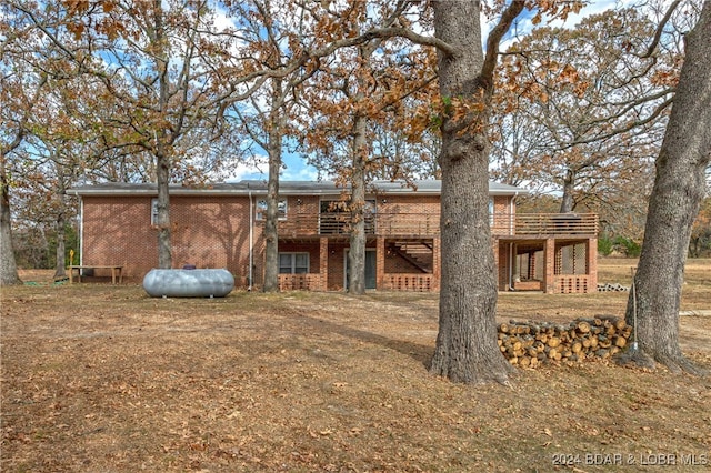 rear view of property with a deck