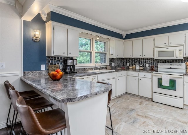 24950 State Rd A Rd, Richland, MO 65556 - kitchen with white appliances, tasteful backsplash, a peninsula, ornamental molding, and white cabinetry
