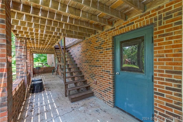 24950 State Rd A Rd, Richland, MO 65556 - property entrance with brick siding and a patio area