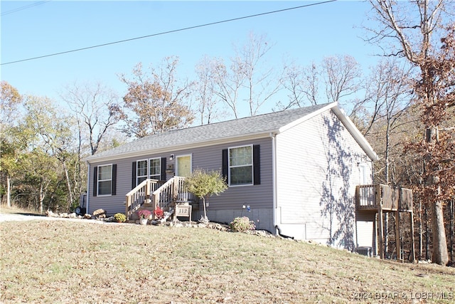 view of front of home with a front yard