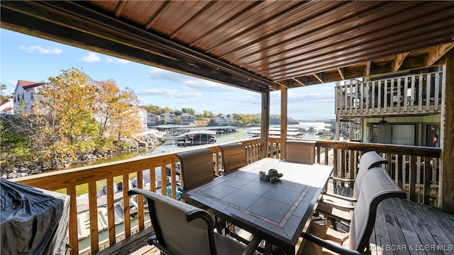 wooden deck with a water view