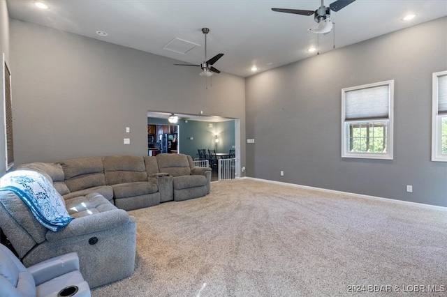 living room featuring ceiling fan and carpet floors