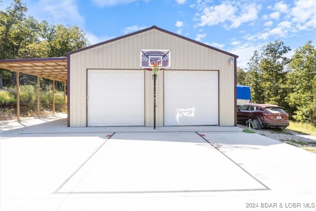 garage featuring a carport