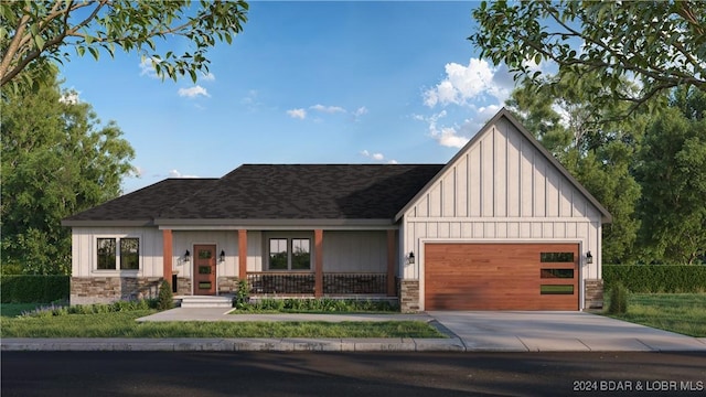 view of front of house featuring covered porch, driveway, a garage, and board and batten siding