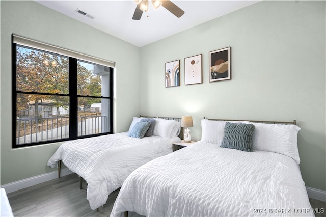 bedroom with hardwood / wood-style flooring and ceiling fan