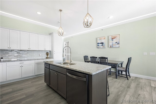 kitchen featuring white cabinetry, pendant lighting, sink, dishwasher, and light hardwood / wood-style flooring