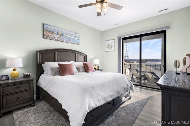 bedroom featuring access to outside, ceiling fan, and light wood-type flooring