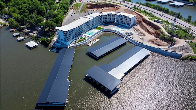 birds eye view of property with a water view