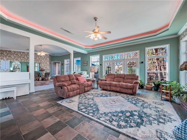 living room featuring ornamental molding and ceiling fan