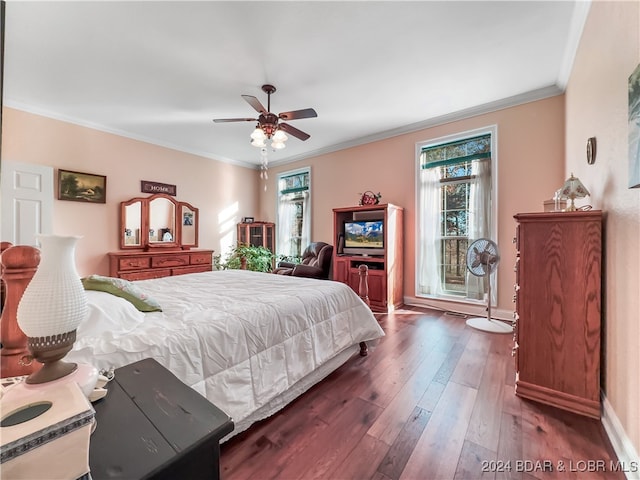 bedroom with ornamental molding, dark wood-type flooring, multiple windows, and ceiling fan