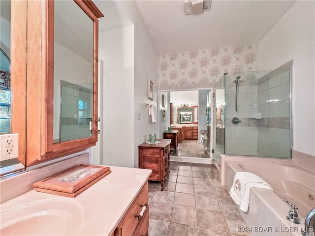 bathroom featuring vanity, tile patterned floors, and separate shower and tub