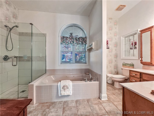 full bathroom featuring tile patterned flooring, shower with separate bathtub, vanity, and toilet