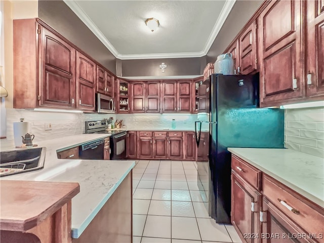 kitchen with black appliances, ornamental molding, backsplash, light tile patterned floors, and sink