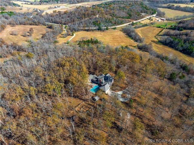 birds eye view of property featuring a rural view