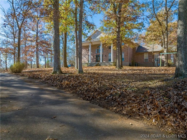 view of side of home with brick siding