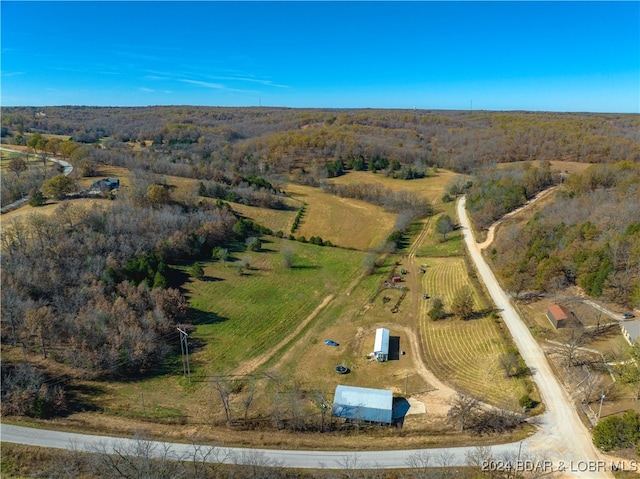 birds eye view of property featuring a rural view