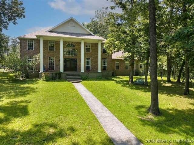 293 Windsong, Camdenton, MO 65020 - neoclassical home featuring a front yard and brick siding