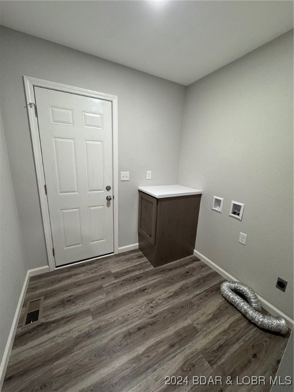 washroom with dark hardwood / wood-style flooring, hookup for a washing machine, and hookup for an electric dryer