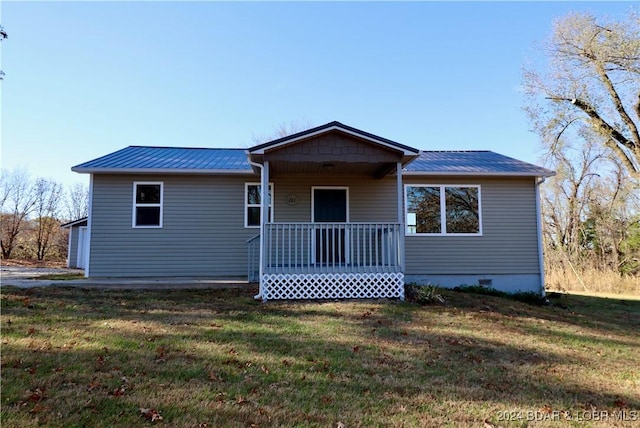 261 Buffalo Linn Creek Rd, Macks Creek, MO 65786 - view of front of home featuring a front yard, a metal roof, and a porch