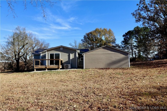 261 Buffalo Linn Creek Rd, Macks Creek, MO 65786 - back of house with a deck and a lawn