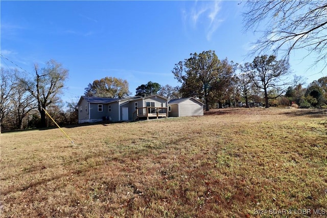 261 Buffalo Linn Creek Rd, Macks Creek, MO 65786 - view of green lawn featuring a wooden deck