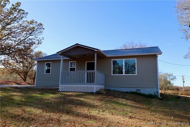 261 Buffalo Linn Creek Rd, Macks Creek, MO 65786 - view of front of home featuring covered porch, a front yard, a metal roof, and crawl space