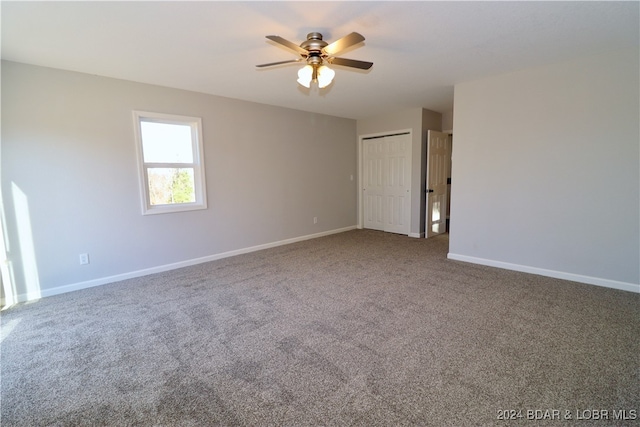 empty room with carpet flooring and ceiling fan