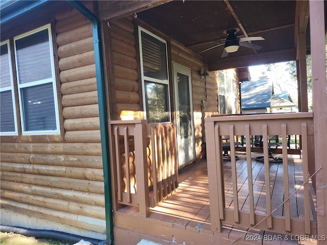 wooden terrace featuring ceiling fan