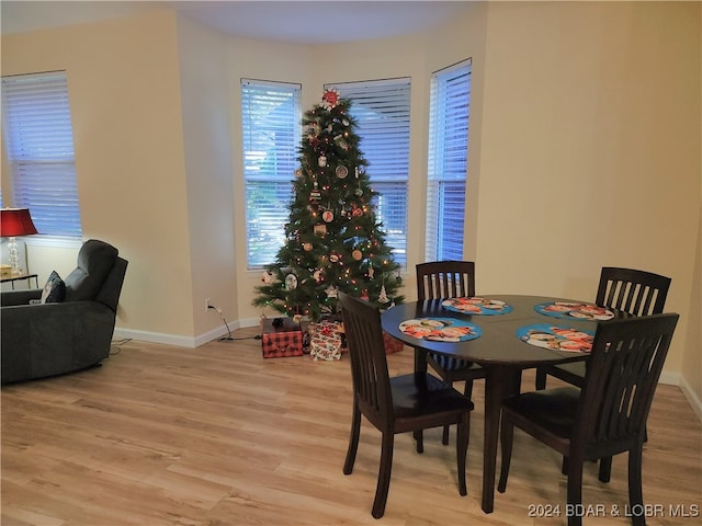 dining area with light hardwood / wood-style flooring