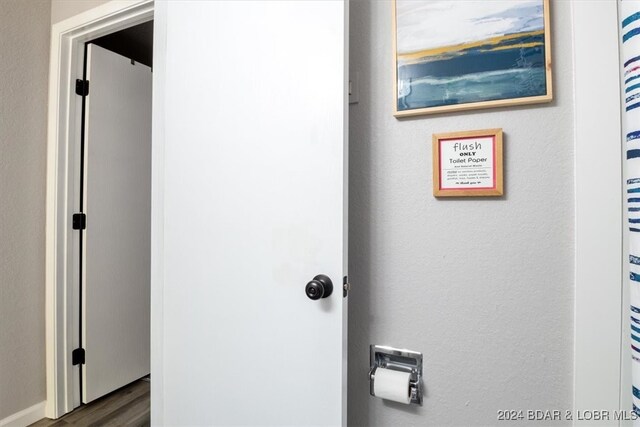 150 Southwood Shores Pl Bldg 159Unit Unit 1B, Lake Ozark, MO 65049 - hall with dark wood-type flooring