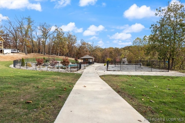 view of property's community with a yard