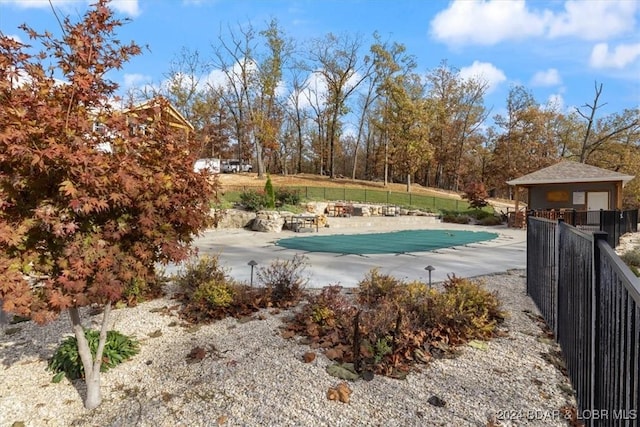 view of pool with a fenced in pool, a patio area, and fence