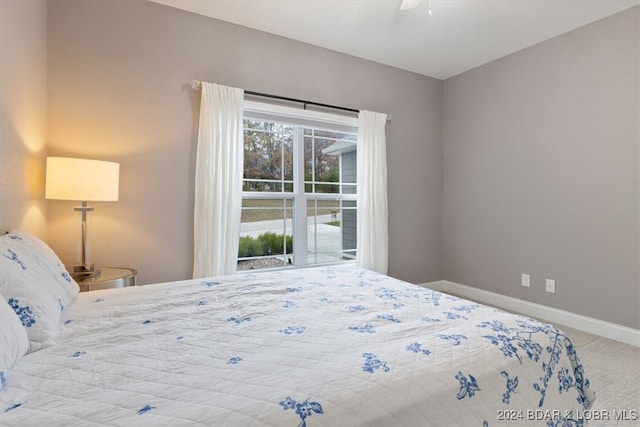 bedroom with ceiling fan and carpet