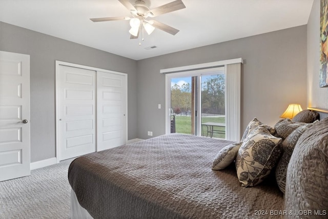 bedroom featuring ceiling fan, light carpet, a closet, and access to outside