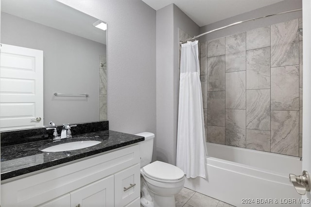 full bathroom featuring shower / bath combo with shower curtain, tile patterned flooring, vanity, and toilet