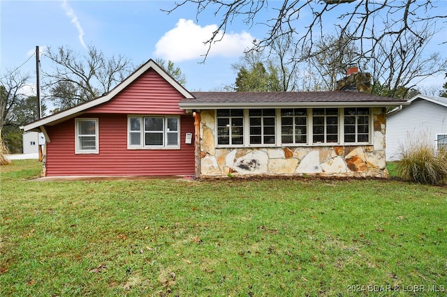 ranch-style house with a front yard