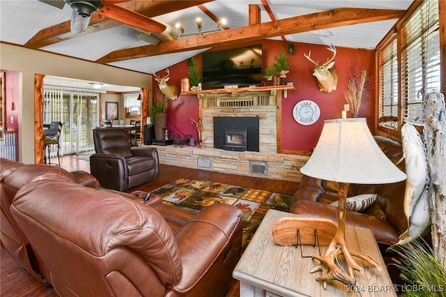 living room with lofted ceiling with beams, a wealth of natural light, and wood-type flooring