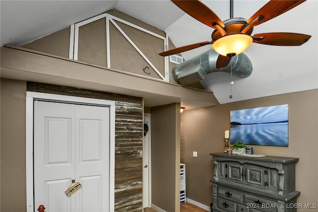 interior space featuring hardwood / wood-style floors, lofted ceiling, and ceiling fan