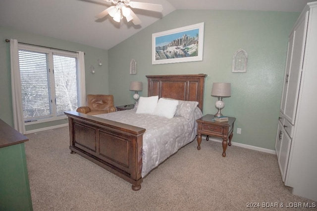 bedroom with ceiling fan, light colored carpet, and lofted ceiling