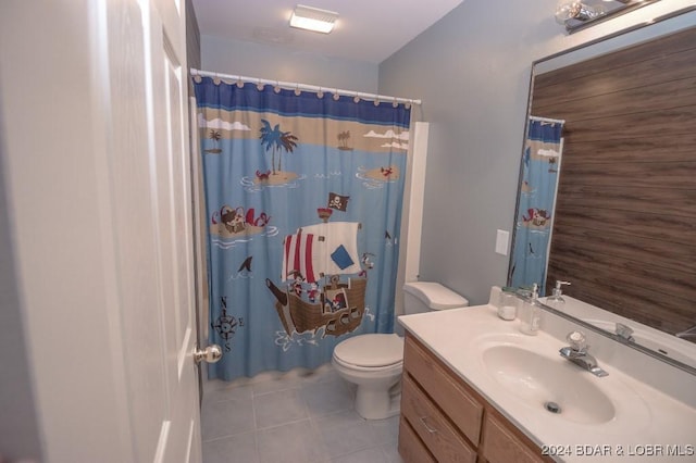 bathroom with walk in shower, tile patterned flooring, toilet, wooden walls, and vanity