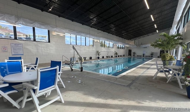 view of swimming pool with a patio