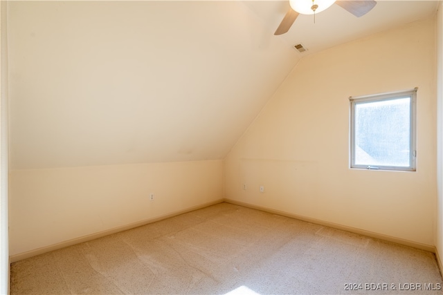 additional living space with ceiling fan, carpet flooring, and vaulted ceiling