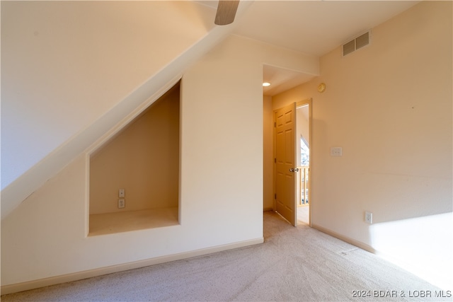 bonus room with light carpet