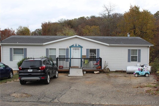 manufactured / mobile home with a wooden deck