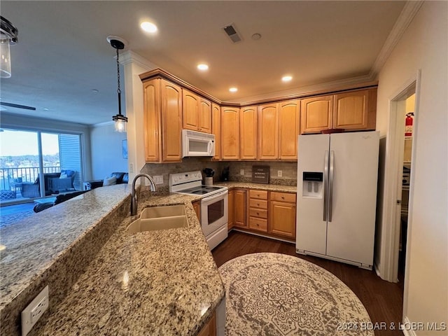 kitchen with white appliances, light stone countertops, pendant lighting, decorative backsplash, and sink