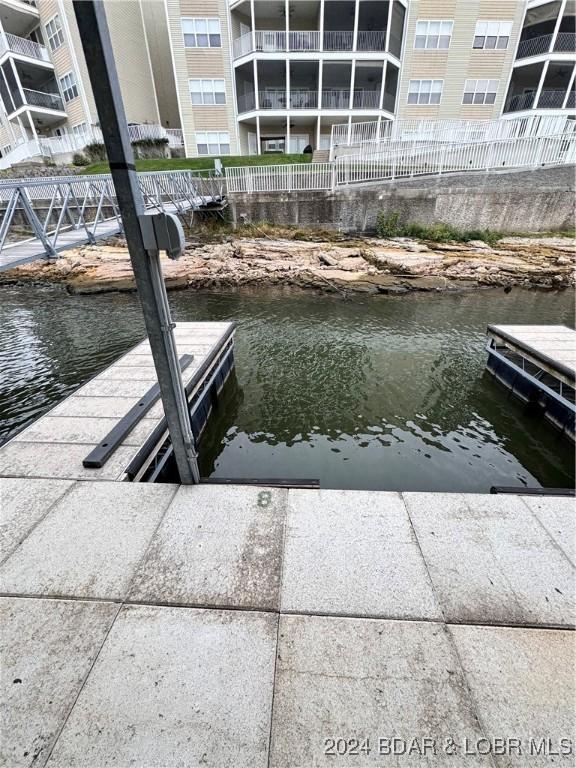 dock area with a water view